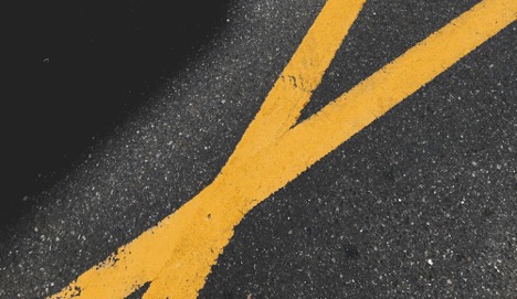 Intersecting lines of yellow road paint